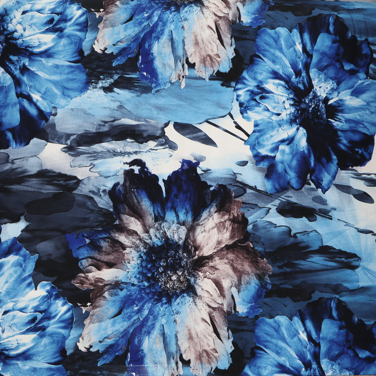 A close-up of a floral fabric pattern featuring large watercolor-style flowers in shades of blue, navy, and beige on a white background.